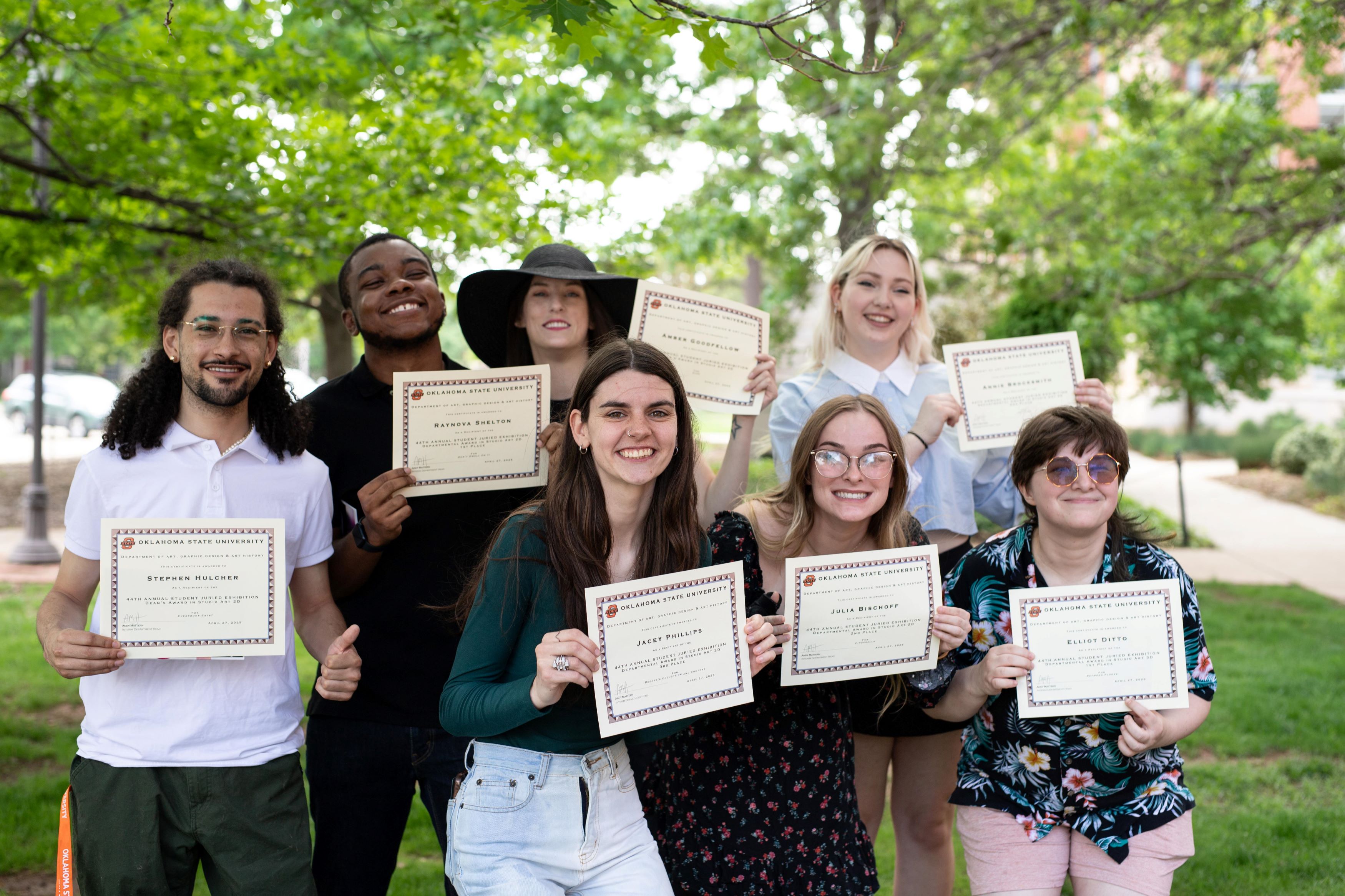 Group of students with their award certificates