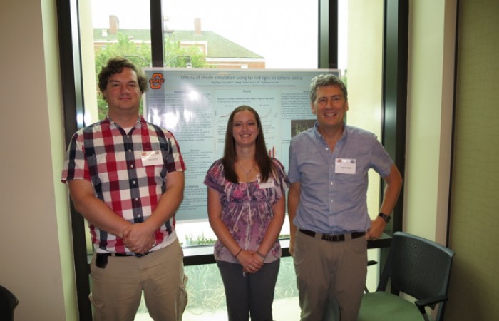 John, Kaytlyn, and Andrew with Kaytlyn's Poster