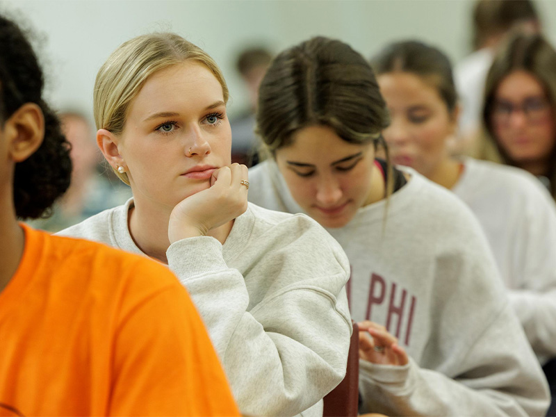 Students sitting in rows in a classroom.