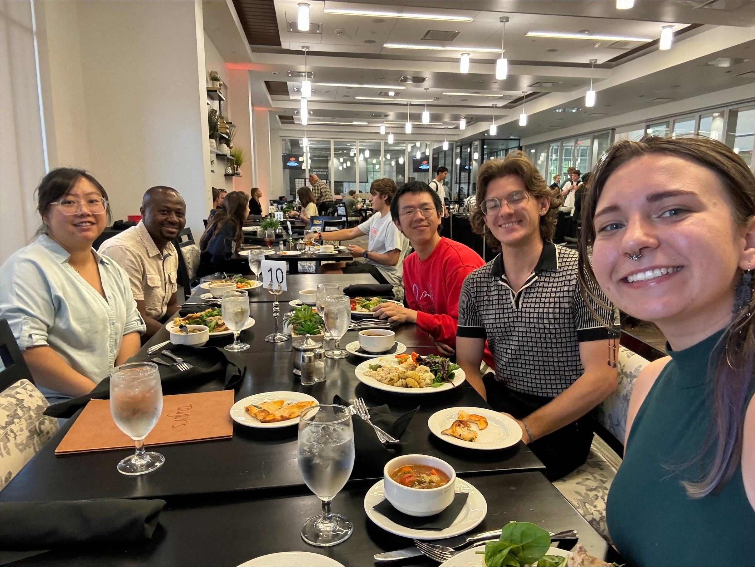 Student enjoying a meal after a conference. Student enjoying a meal after a conference.