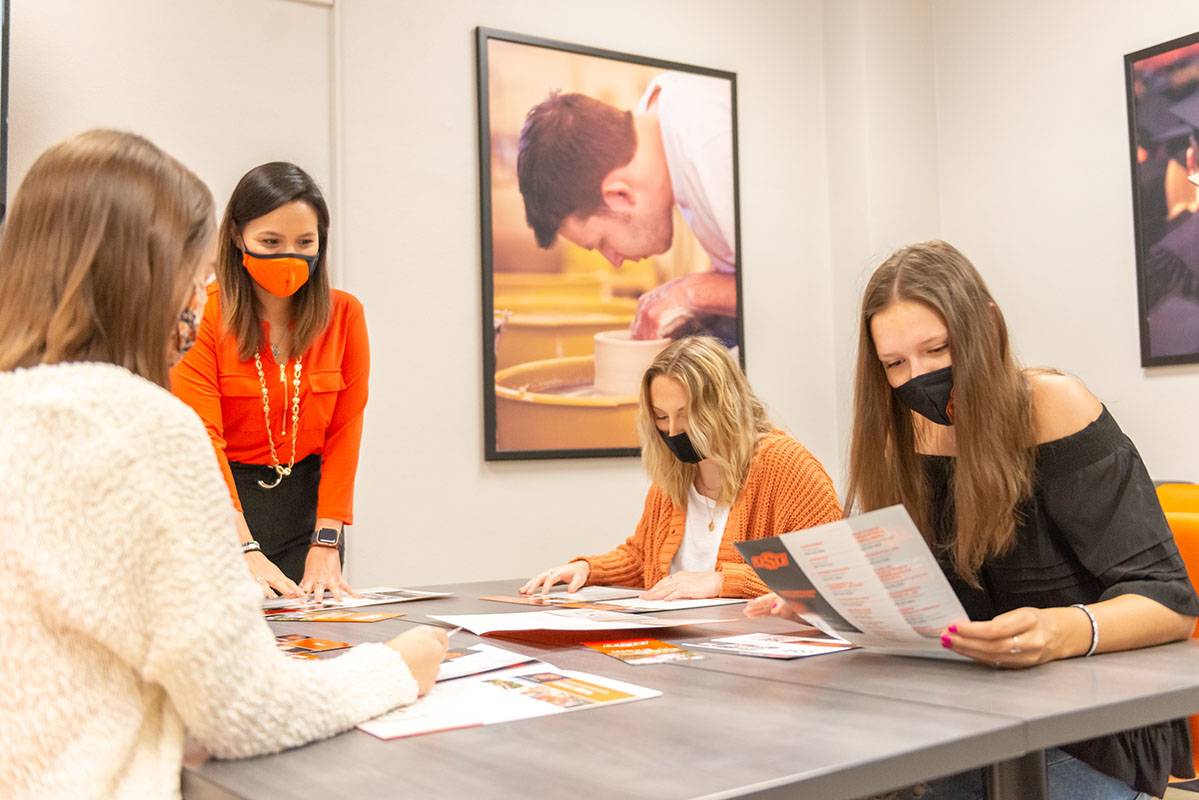 People at a table looking over brochures