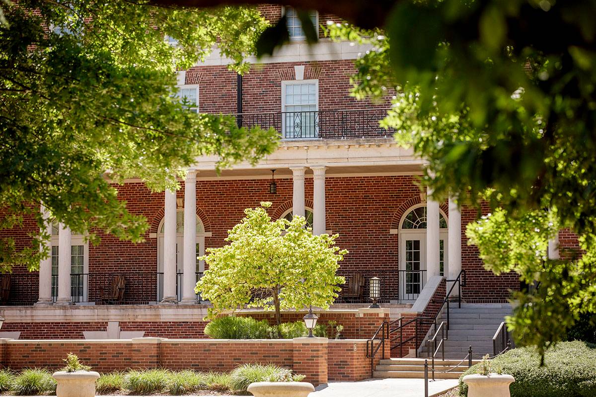 Social Sciences and Humanities Building visible through the trees
