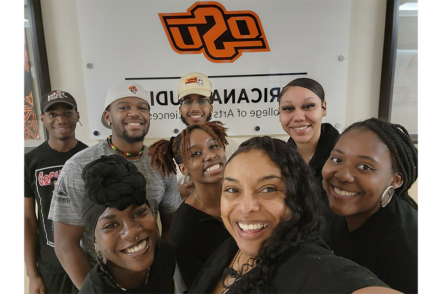 Students posing in front of Africana Studies Students posing in front of Africana Studies