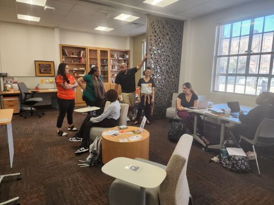 four campus staffers introducing themselves to Center students