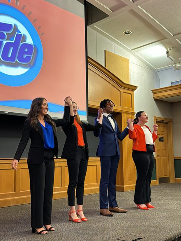 NSAC Team on stage taking a bow