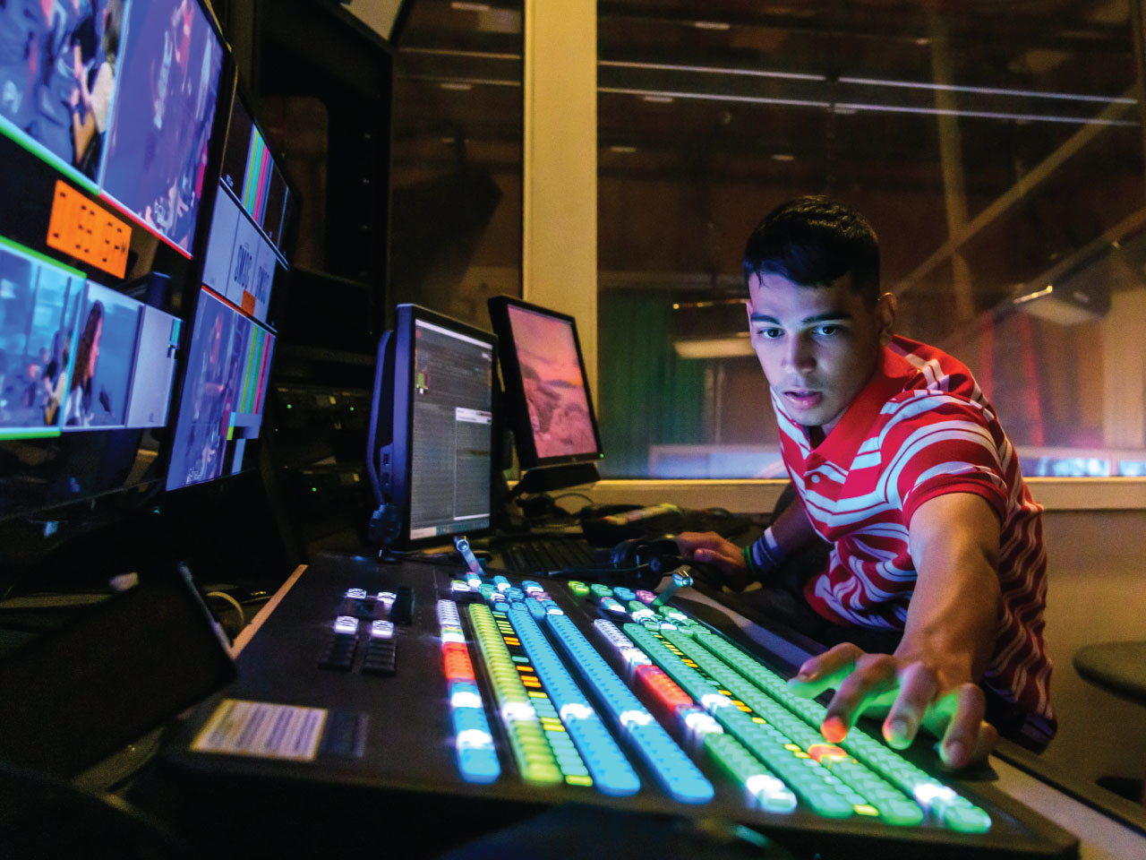 Male student working studio switcher Male student working studio switcher