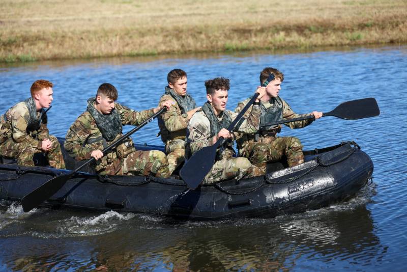 Cadets rowing a zodiac boat