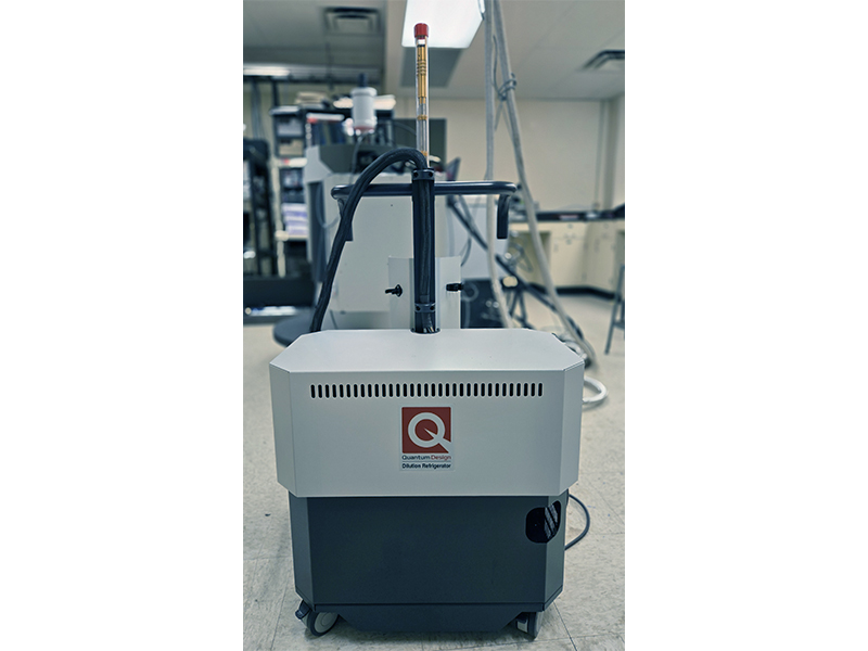 Quantum Design PPMS DynaCool system with integrated 9 Tesla superconducting magnet and temperature control from 50 mK to 400 K, used for precision measurements of magnetic, thermal, and electrical properties.