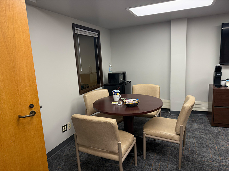 Interior of a room with dining table.