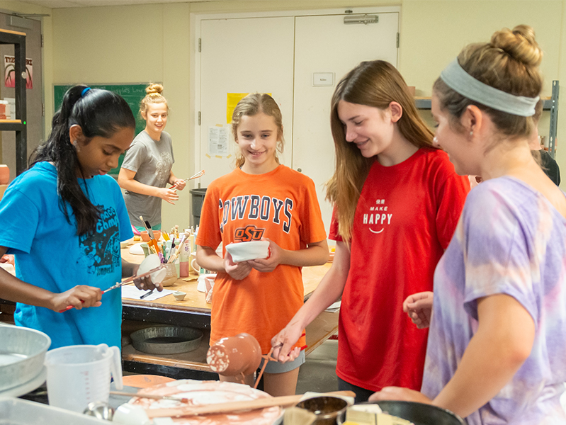 Kids creating pottery