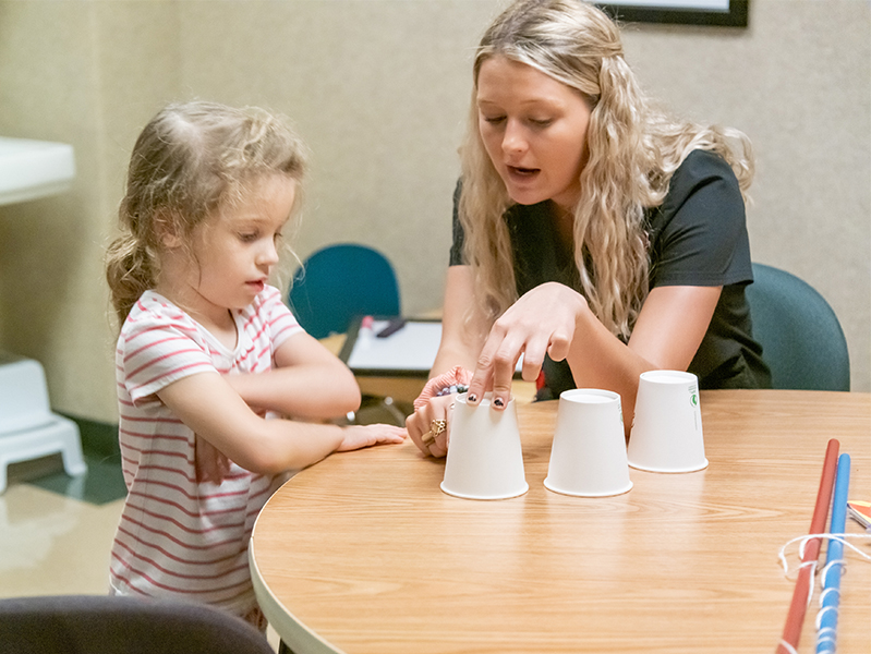 instructor and child at Reading Readiness Camp