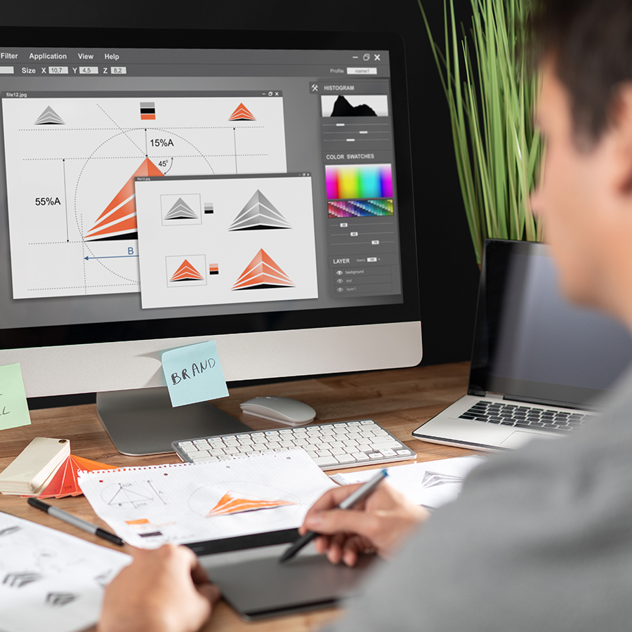 Man at a computer doing graphic design male doing graphic design on a computer