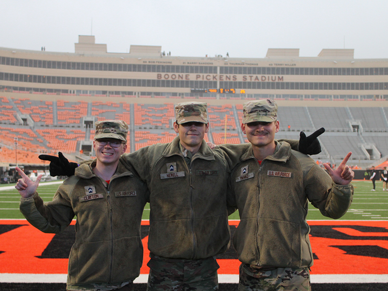 Clayton, Newell, and Turner Camacho at an OSU football game