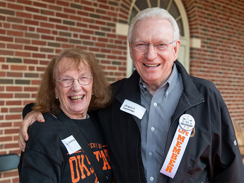 An elderly man and woman smiling together