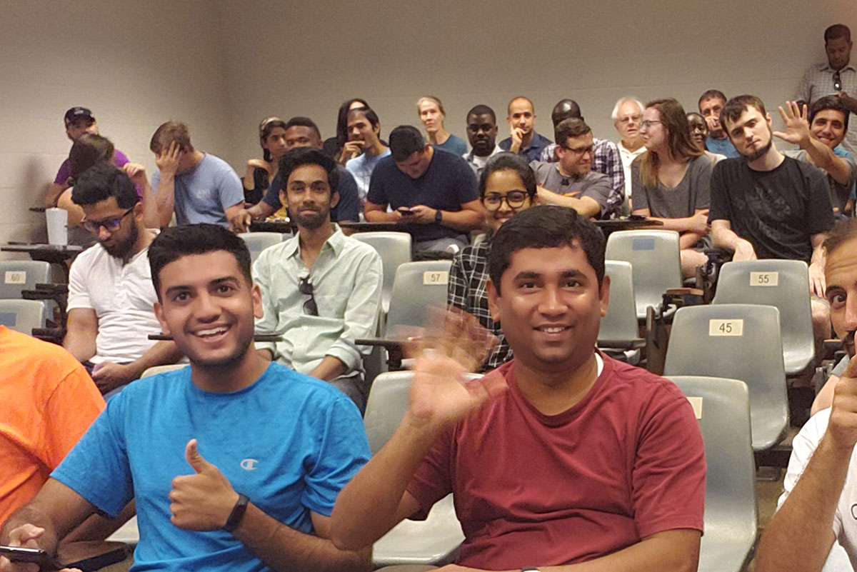 Grad students with thumbs up