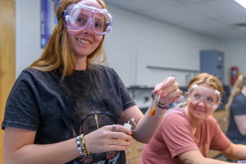 chemistry student holding test tube chemistry student holding test tube