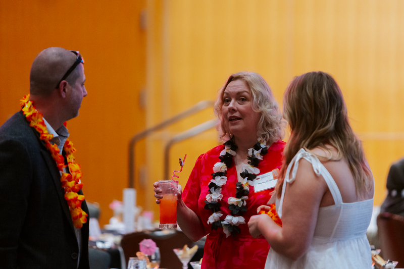 Martha Halihan visiting with Sophia Hunt and her dad at the Banquet.