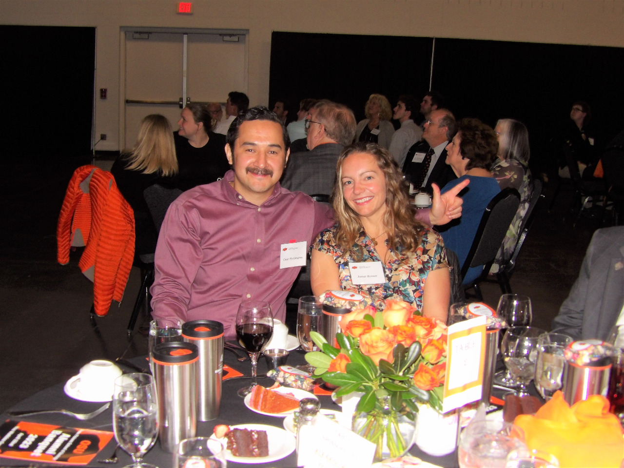 Dr. Conn Wethington and Dr. Jamar Bynum sitting together at banquet.