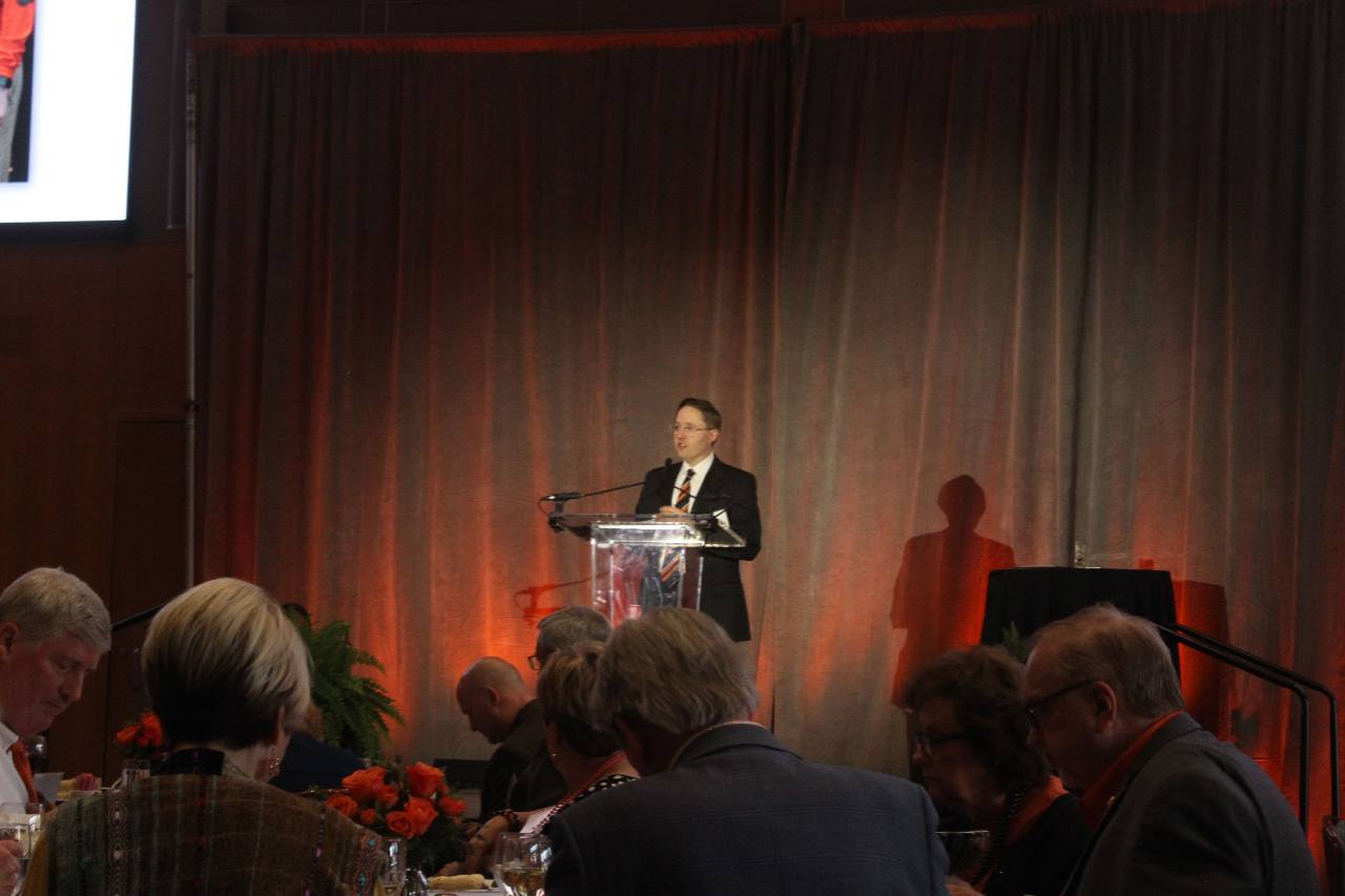 Mr. John Fields at podium giving a speech.