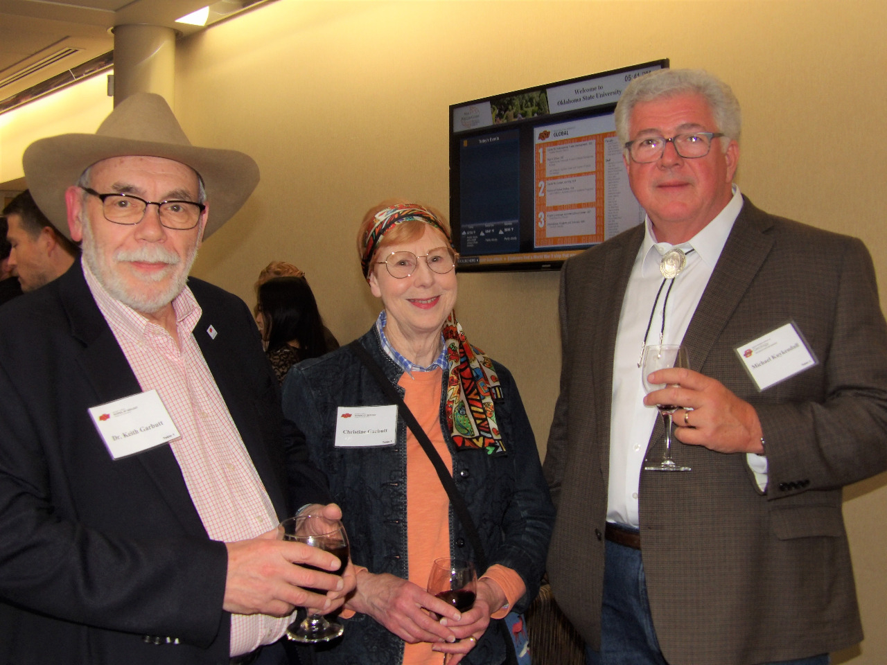 Dr. Keith Garbutt,Mrs. Christine Garbutt and Mr. Michael Kukendall visiting together before banquet begins.
