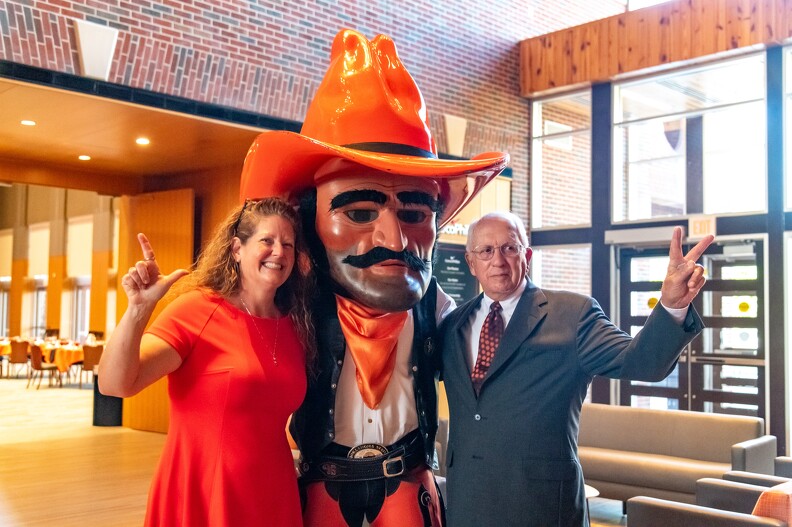 Kristie Ferguson and Gary Stewart posing with Pistol Pete.