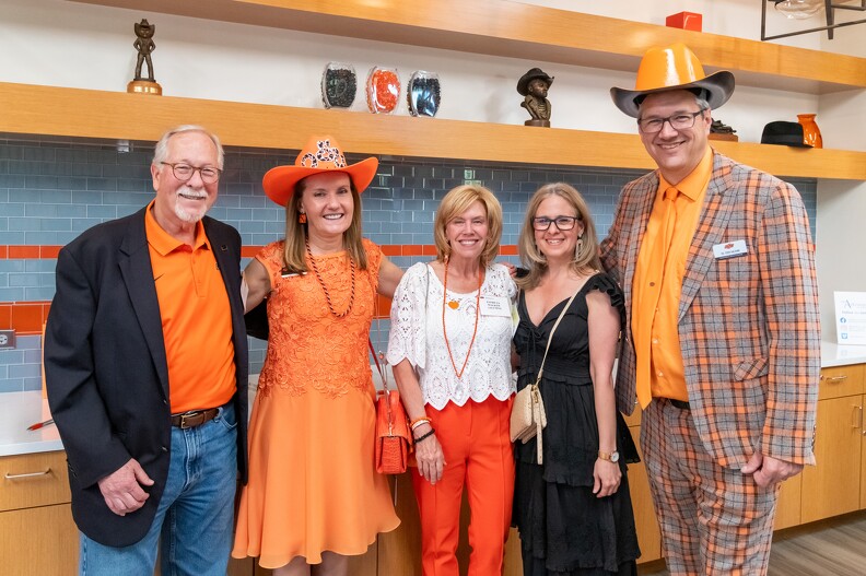 Lanny Holman, Camelia Knapp, Patty Walker, Frances Alvarado Albertorio and Todd Halihan stand together for a group photo.