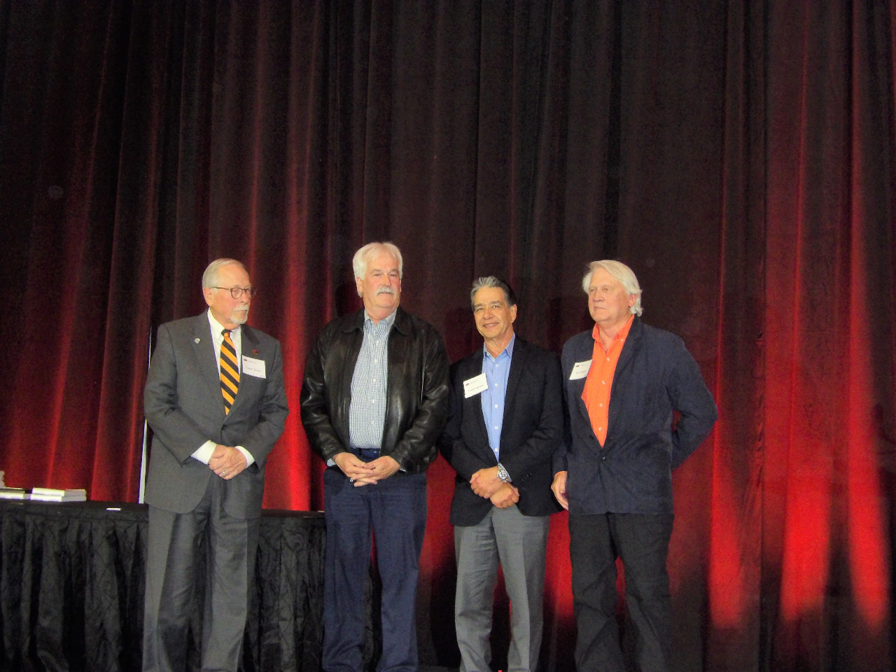  Mr. Lanny, Mr. Joel, Mr. Frank and Mr. Terry standing together on stage before giving out Oklahoma Geological Foundation Awards.