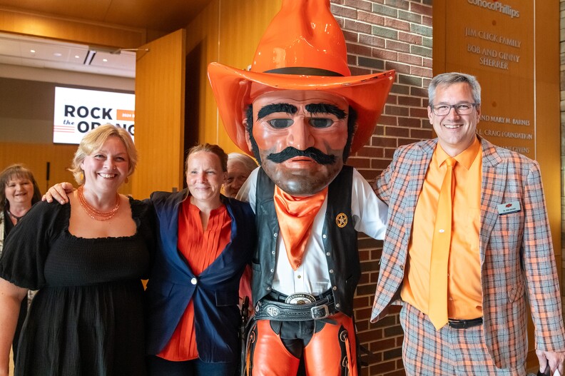 Martha Halihan, Sabrina Beckman, Pistol Pete and Todd Halihan pose for a picture.