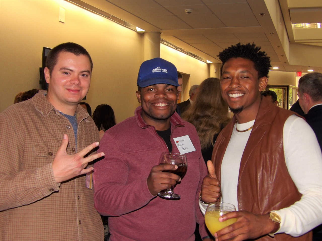 Mr. Mason Martinez, Mr. Damien Davis and Mr. Jordon Massey smiling for a picture together.