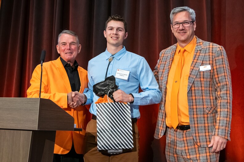 Mike Gaskins and Todd Halihan giving the Outstanding Senior Award to Ian Kallenberg.