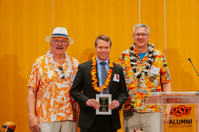 Mike Kuykendall and Todd Halihan giving Ian Cox his Graduate Research Award