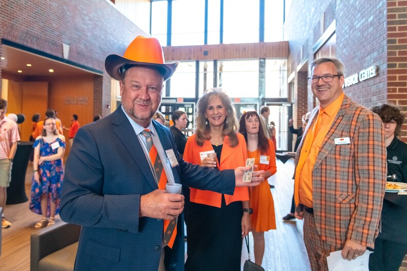 Mike Thornhill, Rosemarie Strong and Todd Hailhan joking around.