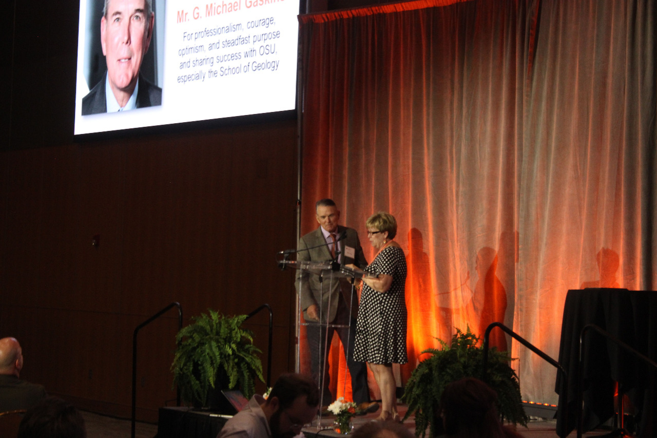 Mr. Mike Gaskins recieving an award from Mrs. Patty Walker.