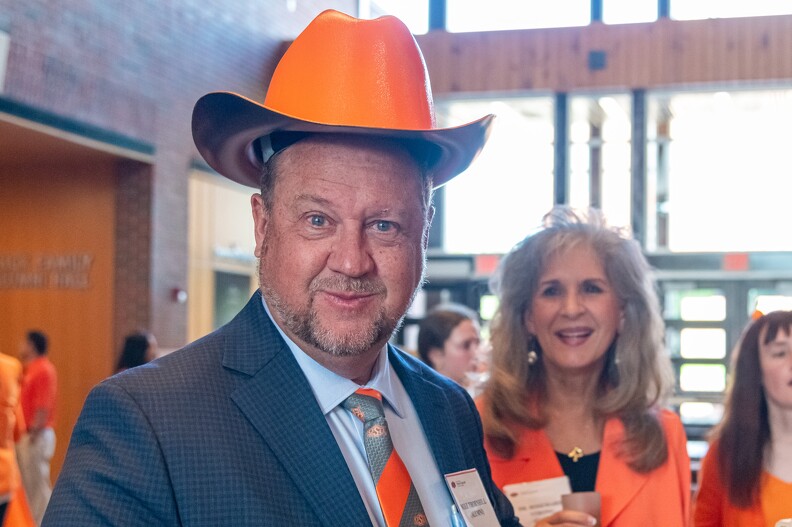 Mike Thornhill wearing a huge orange cowboy hat. 