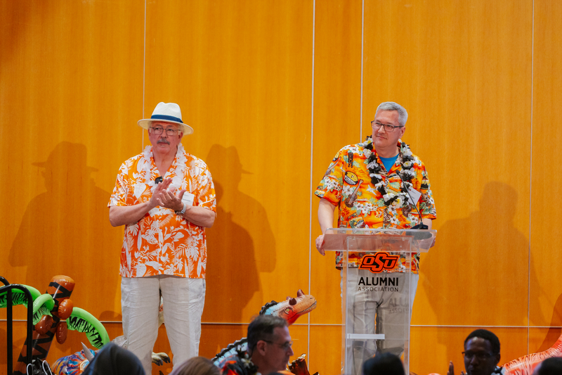 Mike Kuykendall and Todd Halihan announcing students awards and scholarships. 