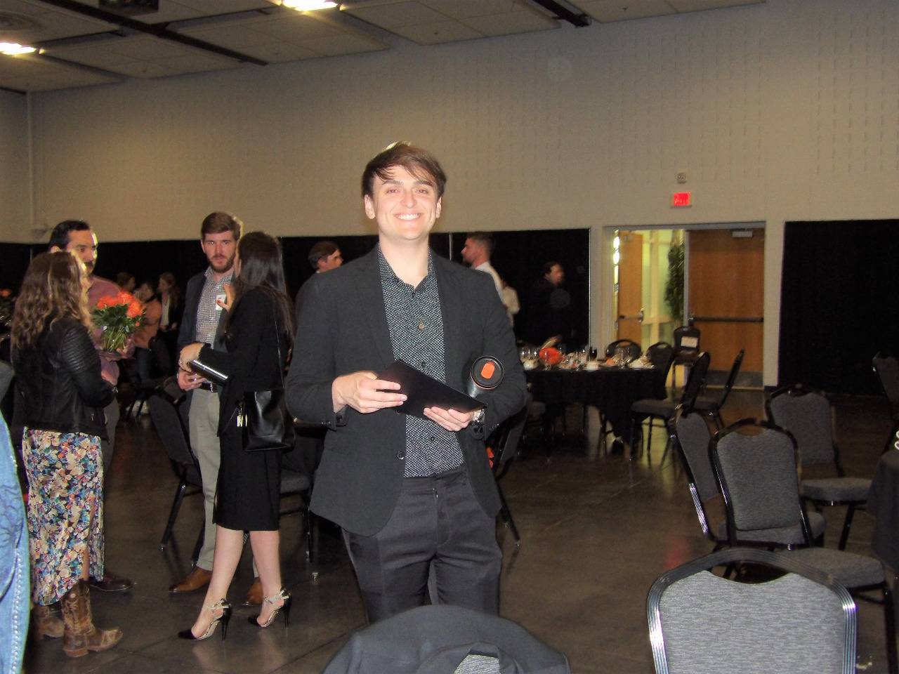 Mr. Nicolas De Los Santos smiling for the camera right after banquet ended.