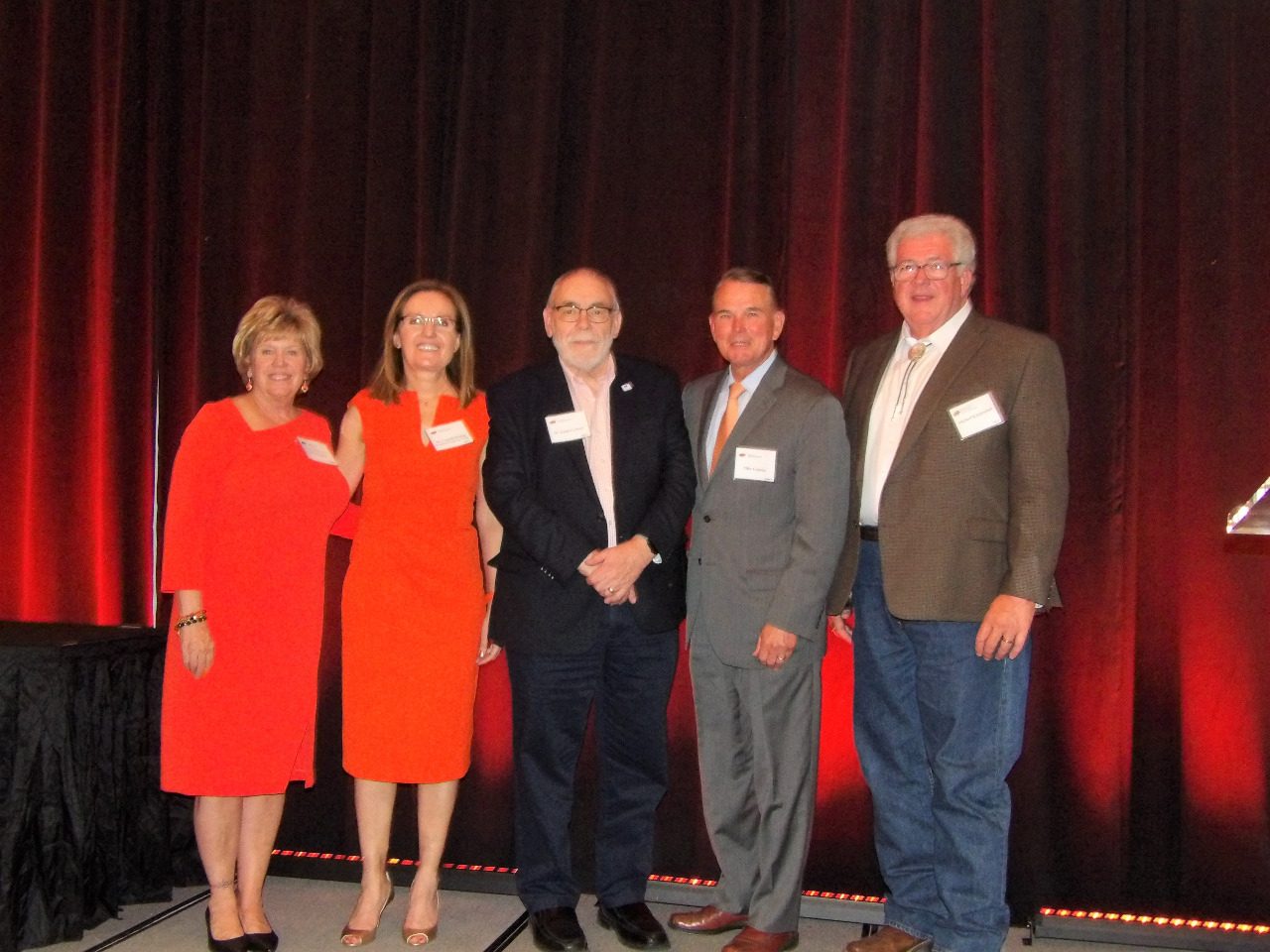 Mrs. Patty Walker, Dr. Camelia Knapp, Mr. Keith Garbutt, Mr. Mike Gaskins and Mr. Michael Kuykendall standing together on stage for a photo.