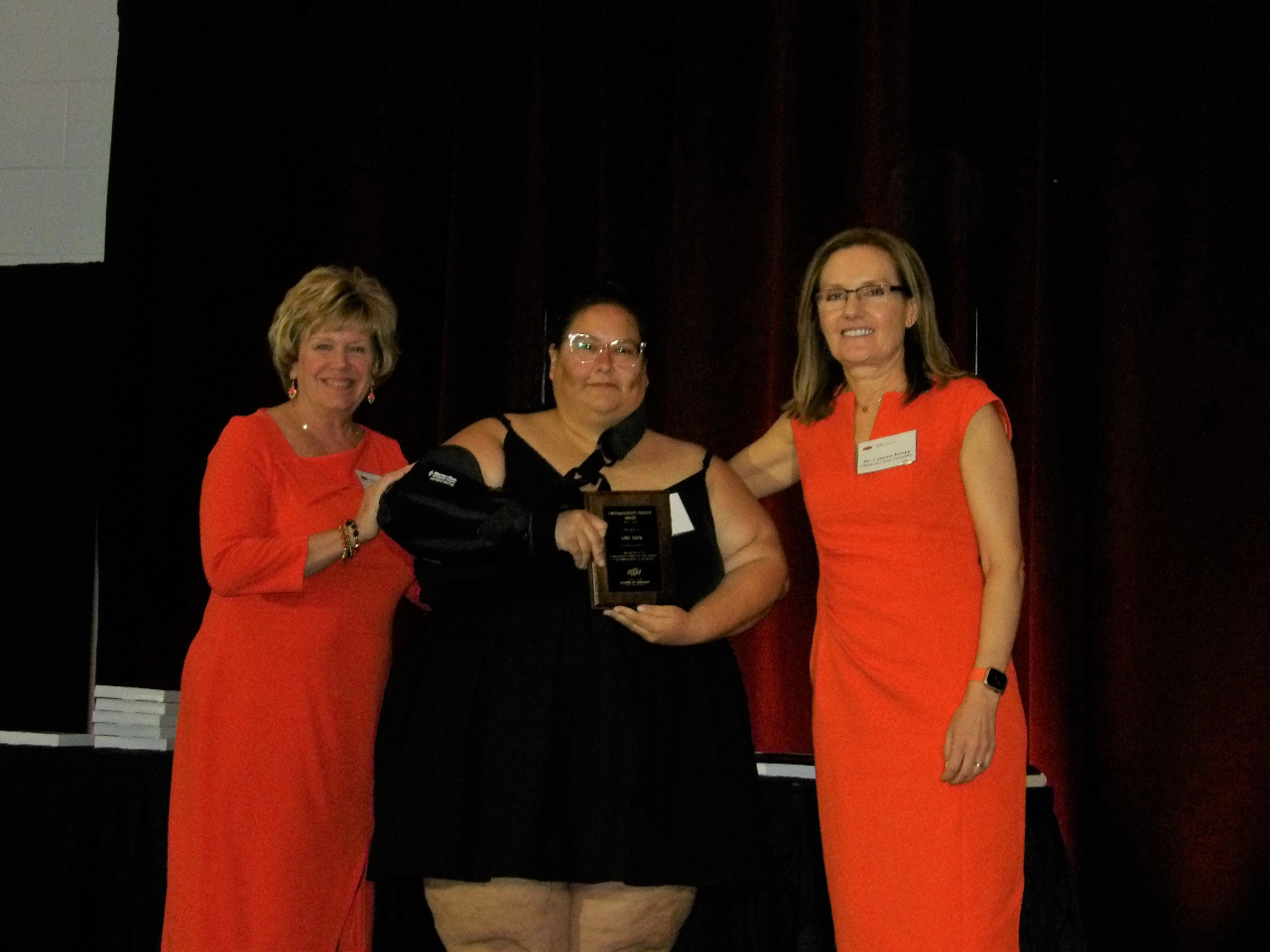Mrs. Patty Walker and Dr. Camelia Knapp presenting award to Ms. Lori Huck.