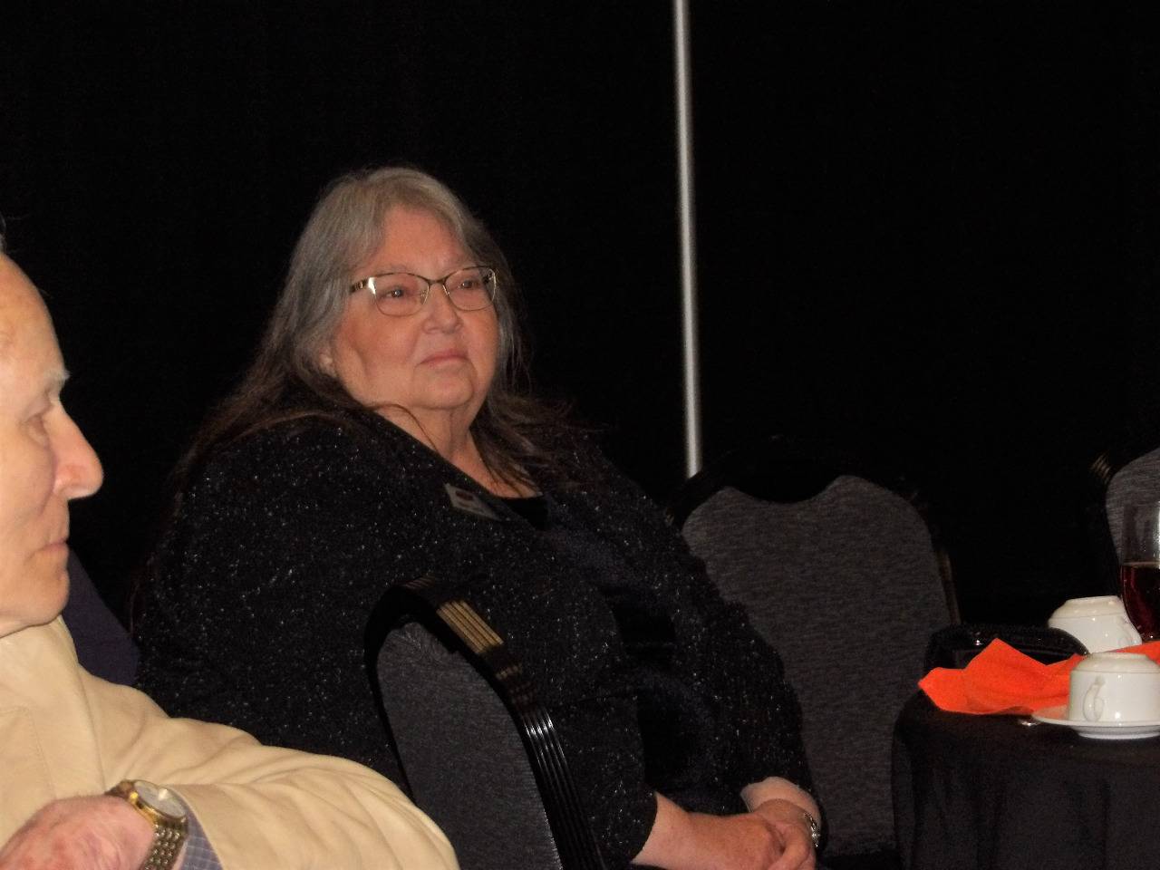 Mrs. Sandy Earls watching the speaker on stage.