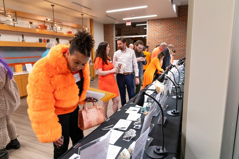 Kelsey Bufford and others checking out what all there is at the silent auction.
