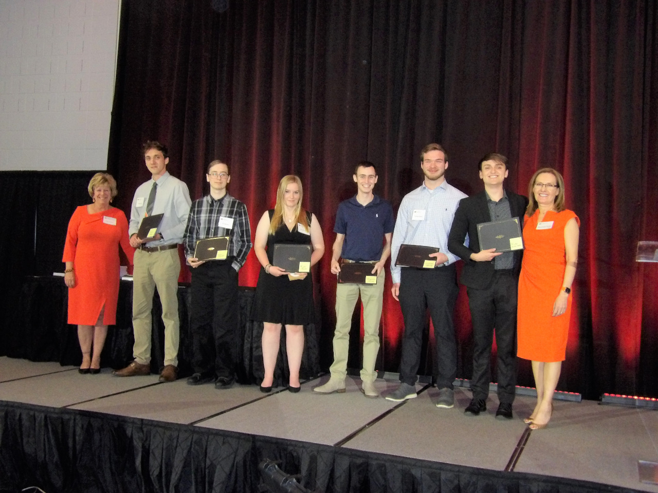 Five male and one female scholarship recipients with Mrs. Patty Walker and Dr. Camelia Knapp. 
