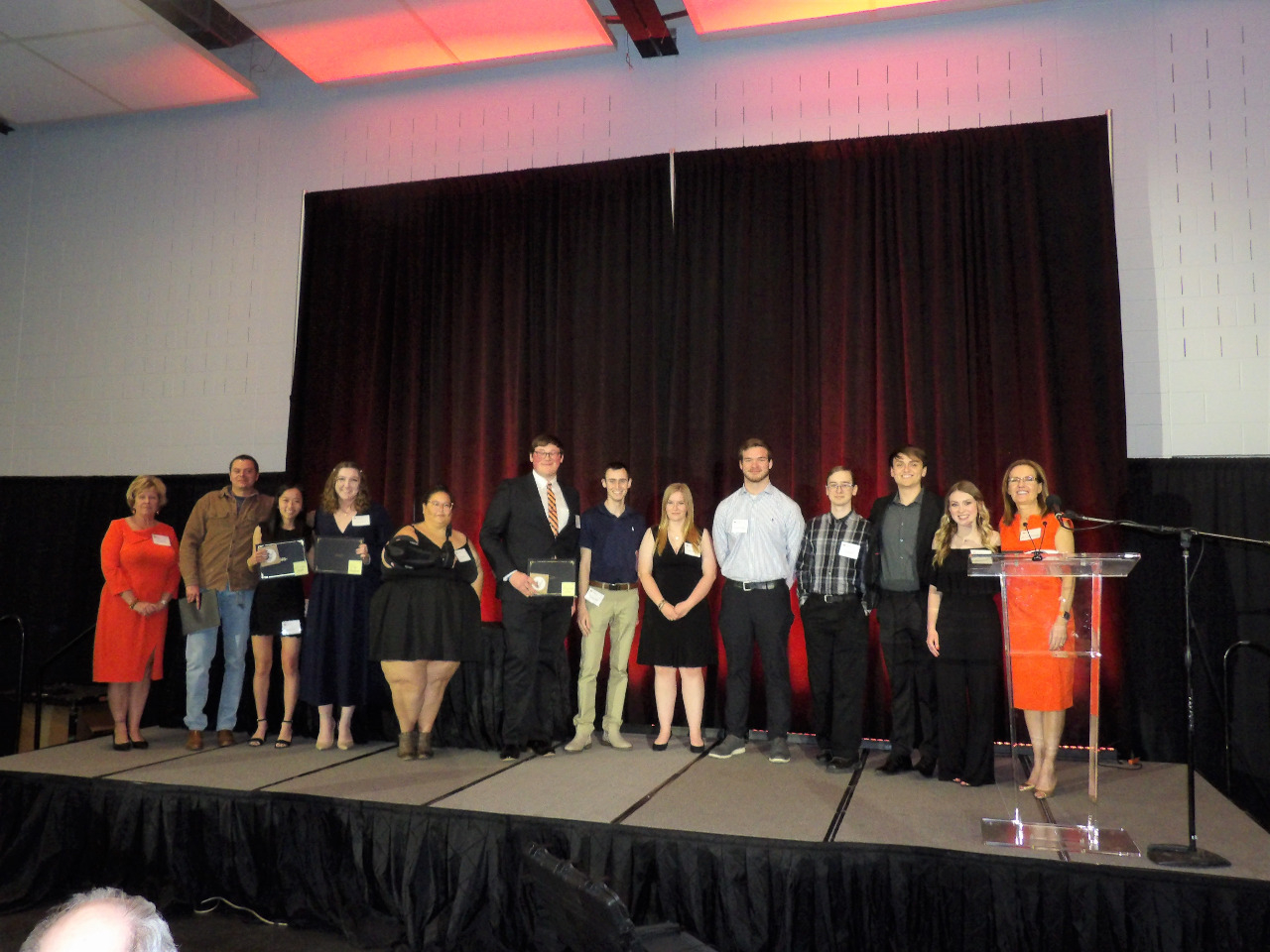 Six male and five female scholarship recipients with Mrs. Patty Walker and Dr. Camelia Knapp.