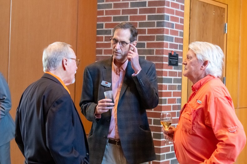 Lanny Holman, James Knapp and Terry Hollera in a deep conversation together.