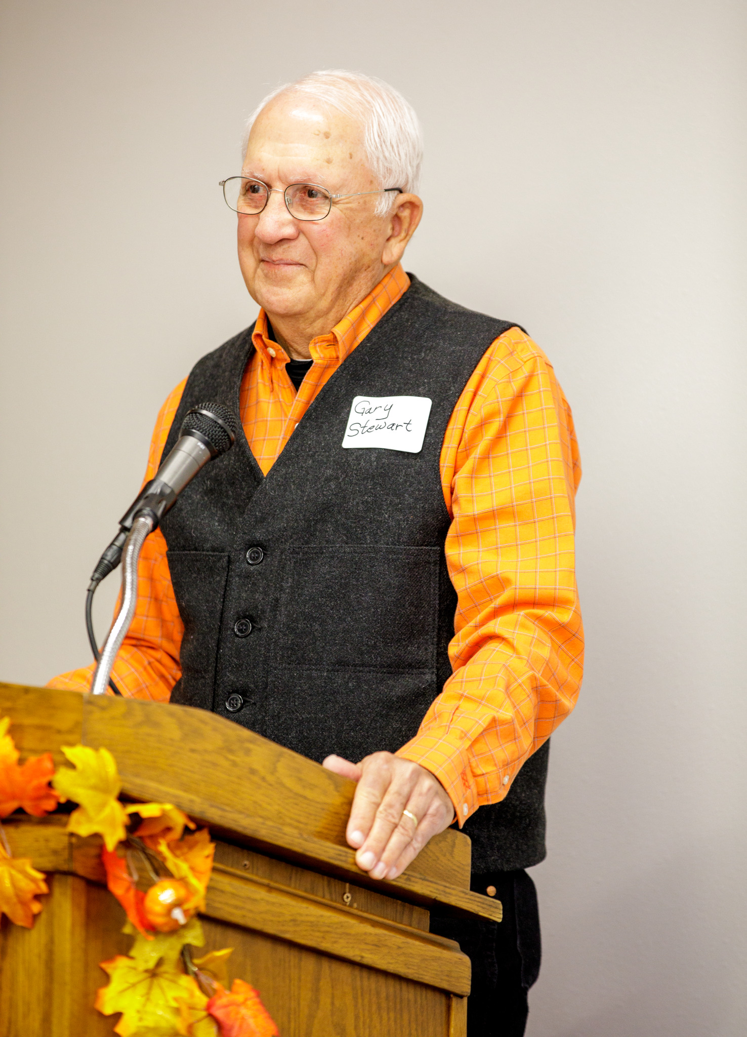 Gary stewart giving a speech at a podium. Gary stewart giving a speech at a podium.