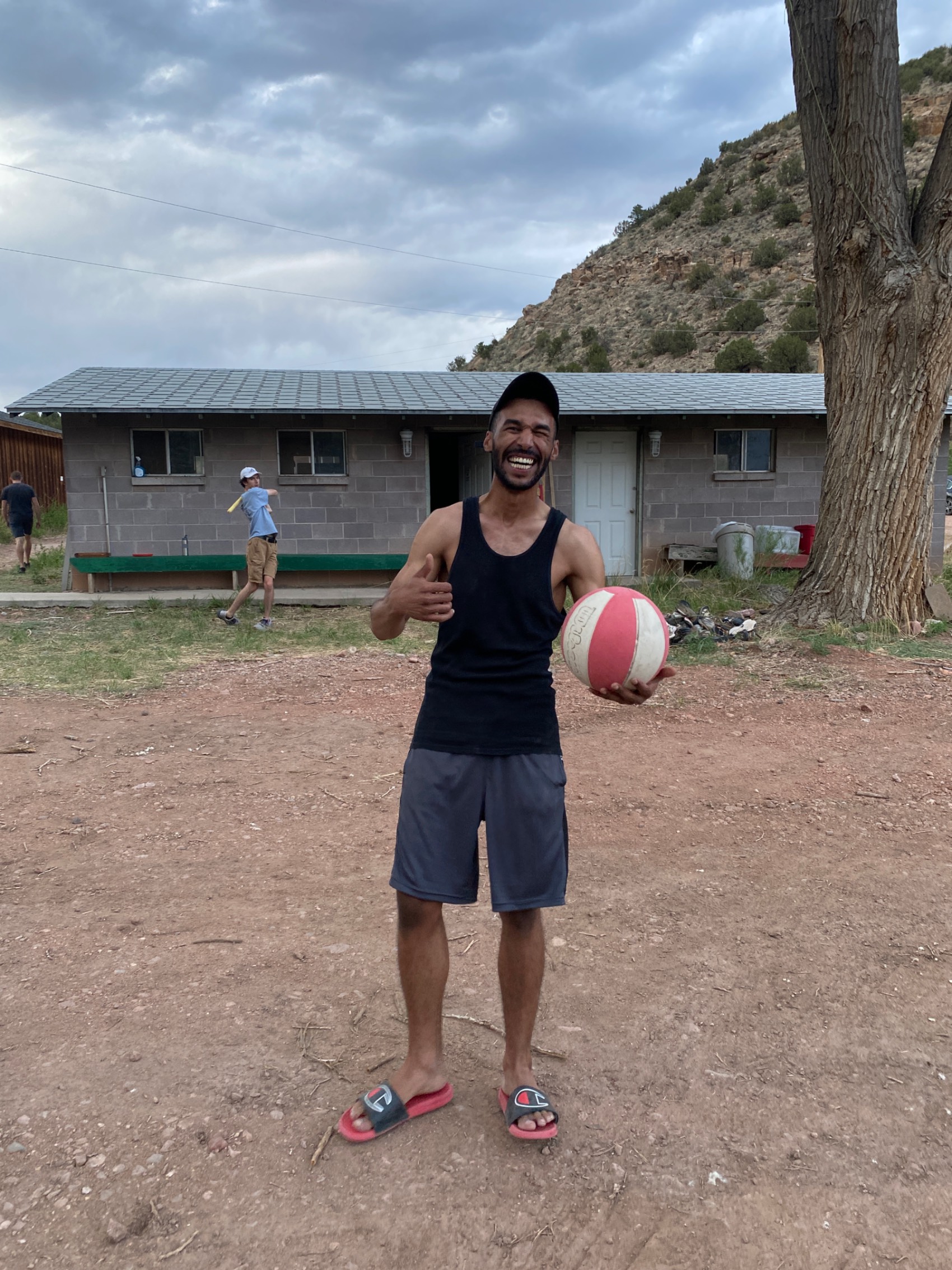 A Student playing with a basketball at camp. A Student playing with a basketball at camp.