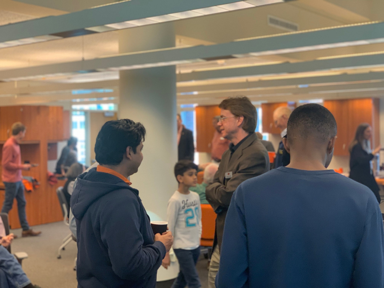 Faculty, Students and Family enjoying each other