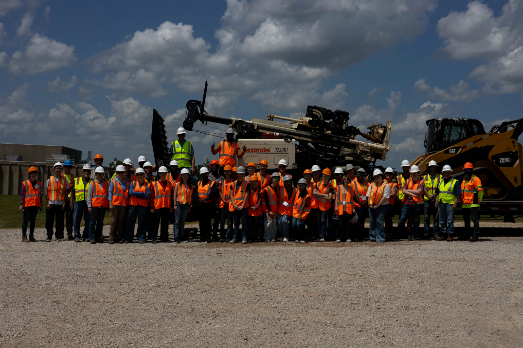 GEO-Rex campers getting a group picture with the crew that taught them to dig a well. GEO-Rex campers getting a group picture with the crew that taught them to dig a well.