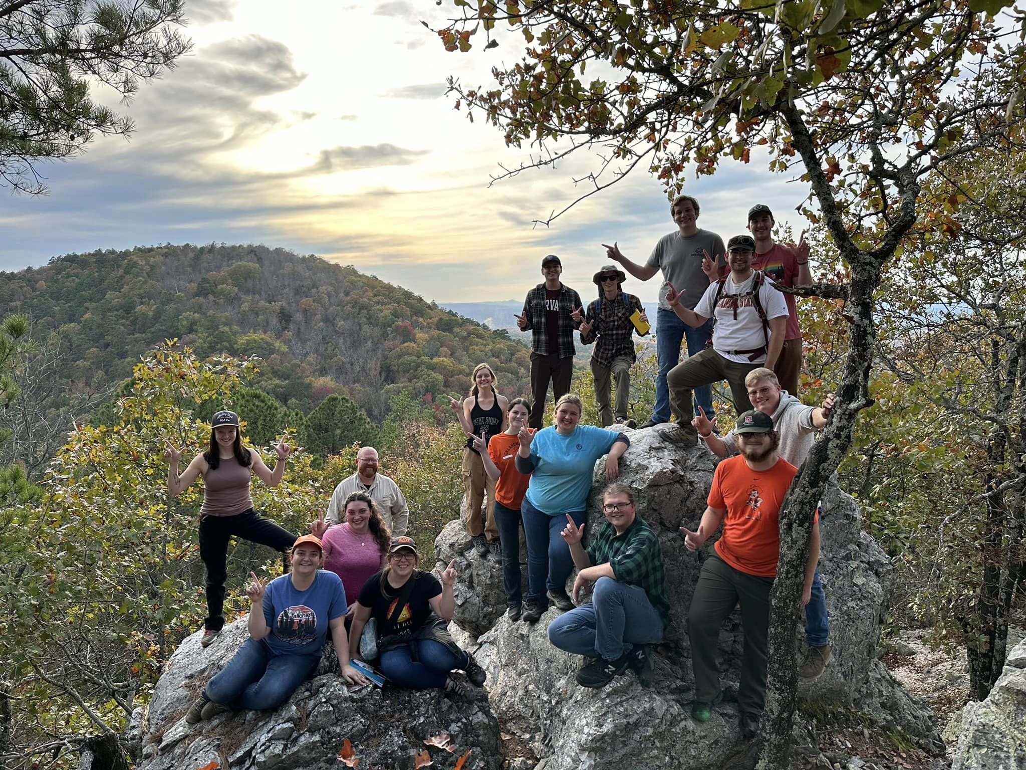8 male and 7 females students along with one male teacher posing in a group on a rock and mineral field trip. 8 male and 7 females students along with one male teacher posing in a group on a rock and mineral field trip.