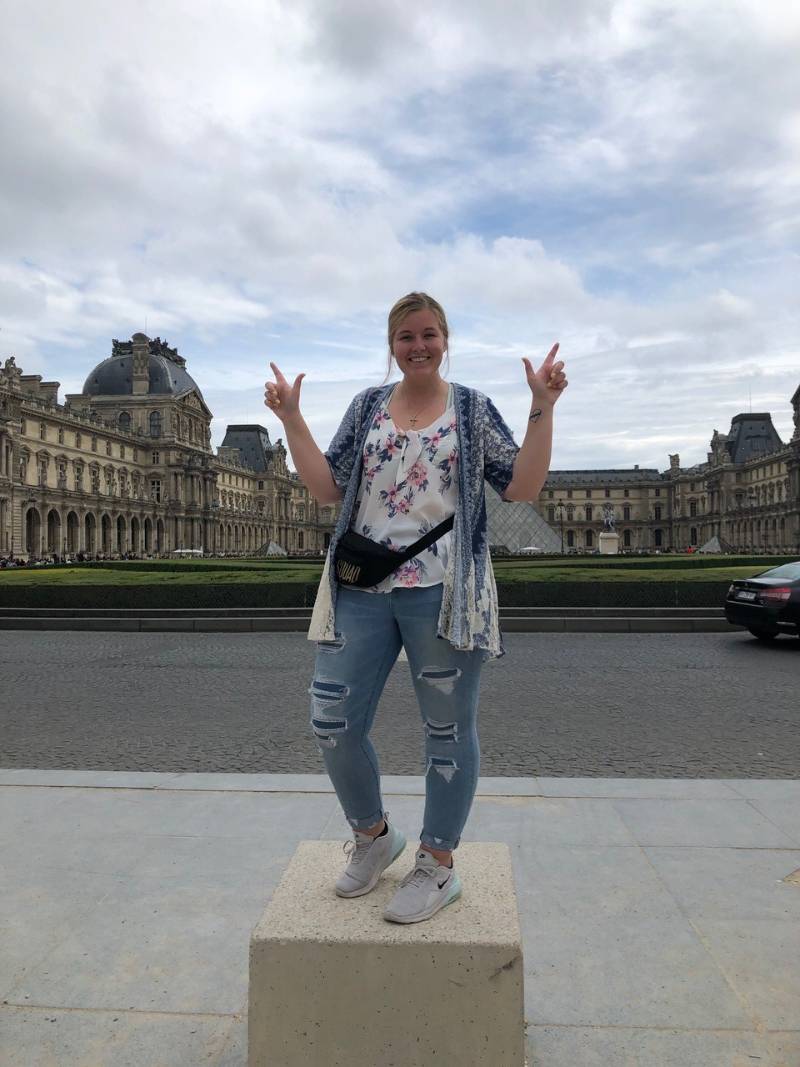 Student in front of the Louvre Student in front of the Louvre
