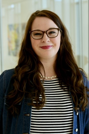 A woman with long brown hair.